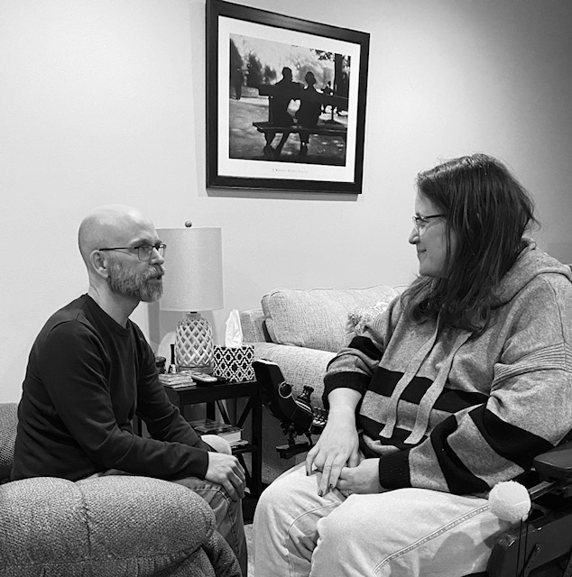 Dan and Jennifer Digmann sitting together during a conversation about living with Multiple Sclerosis for their A Couple Takes on MS podcast.