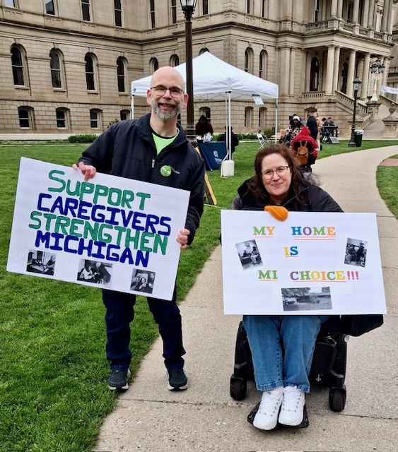 Dan and Jennifer Digmann advocating for caregivers and the MI Choice program outside the Michigan State Capitol during Older Michiganians Day 2026.