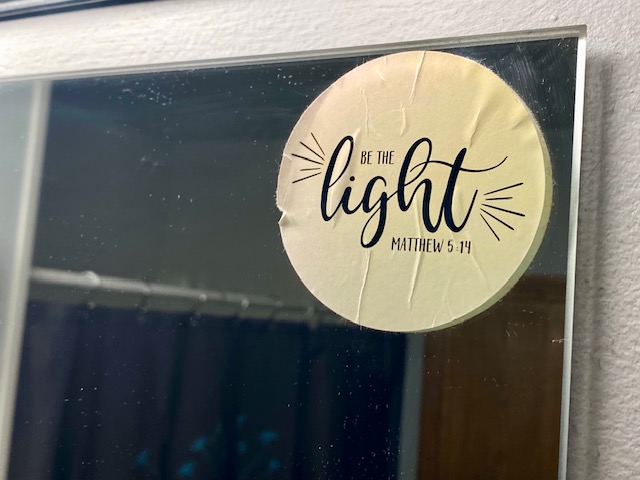 “Be the light” Matthew 5:14 sticker on our bathroom mirror
